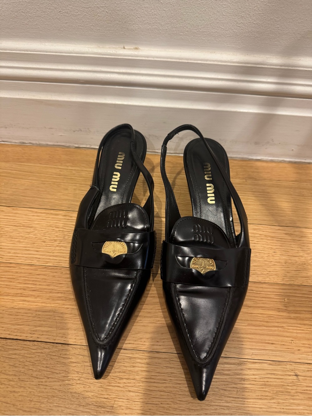 Miu Miu Black Leather Pointed Slingback Loafers with Gold Accent